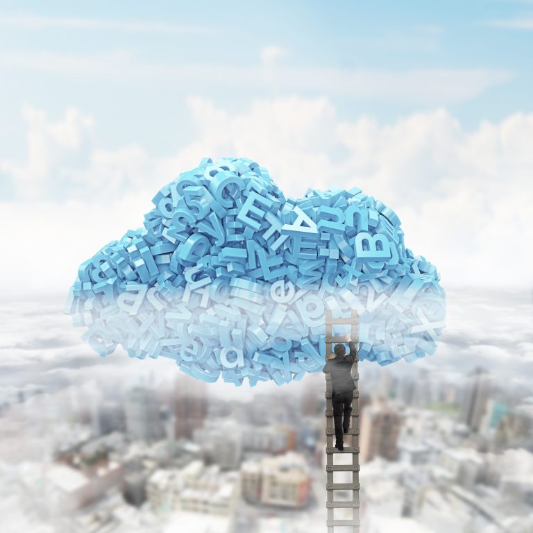 A photo of a person on a latter reaching up towards a technology cloud