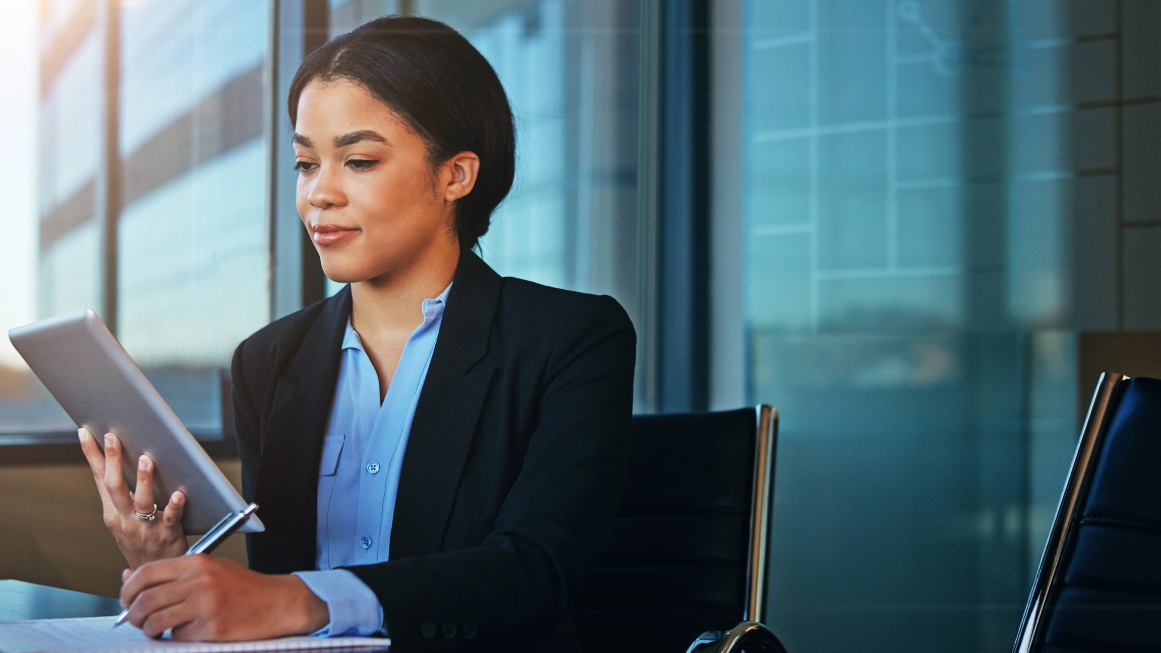 Woman reading IT compliance information